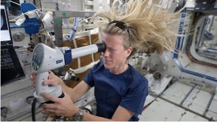 Astronaut takes an eye exam in zero gravity on board this ISS