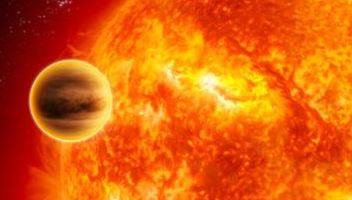 Image is of a  planet orbitting very near a star with what appear to be plasma around it.