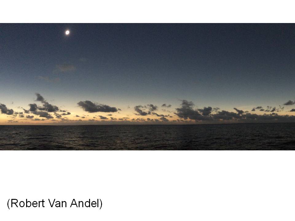 360 degree glow on the horizon during the March 9, 2016 eclipse at sea
