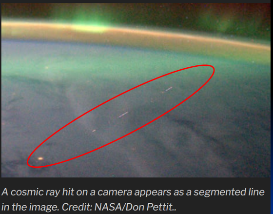 An image of the path of a cosmic ray is shown as it move above the Earth's atmosphere. Image captured by Astronaut Don Pettit